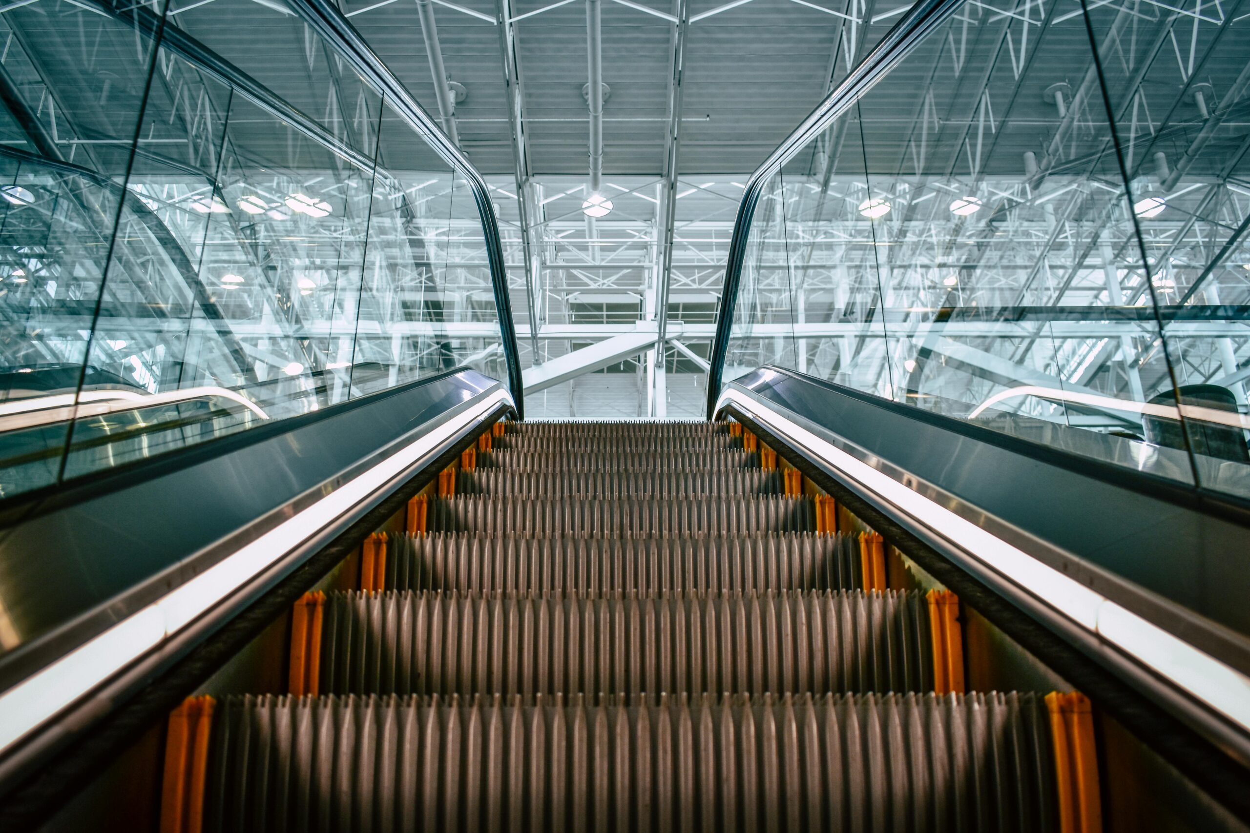 an escalator with a view of the ceiling